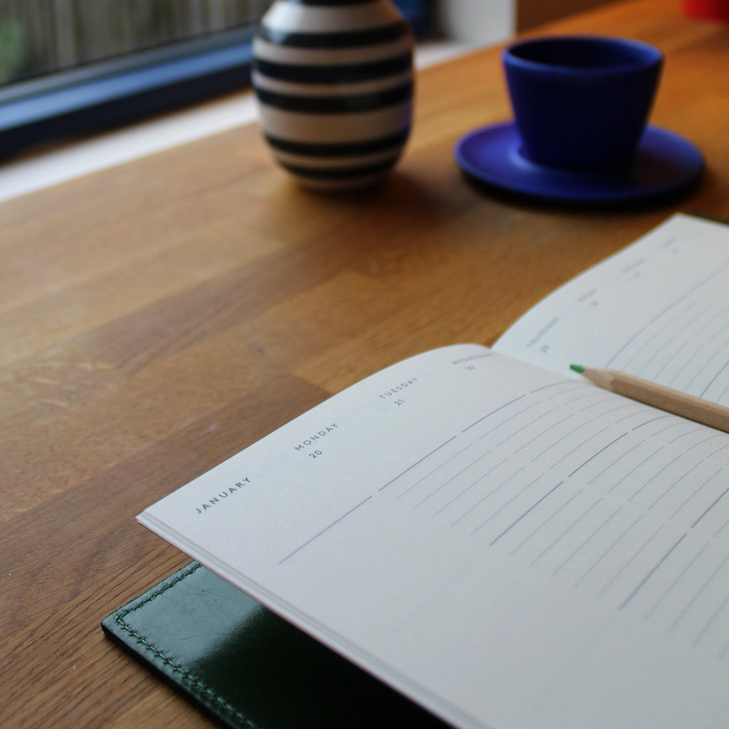 The Mark+Fold Diary with removable leather cover in Avocado Green leather. A collaboration between Mark+Fold the modern stationer, and Doe Leather, two British brands championing good design, longevity and quality make, with provenance and sustainability at the heart of their processes.